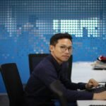 Zhao's Pardon: A New Era for Cryptocurrency? 2 a man sitting at a desk with a computer