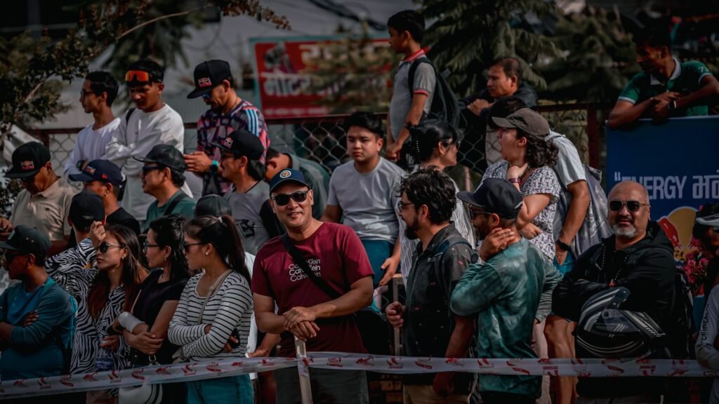 BREAKING: Britain Decides ‘Why Be Fast When You Can Be the Slowest?’—Unveils Europe’s LONGEST Immigration Queue 3 A crowd of people gather watching something.