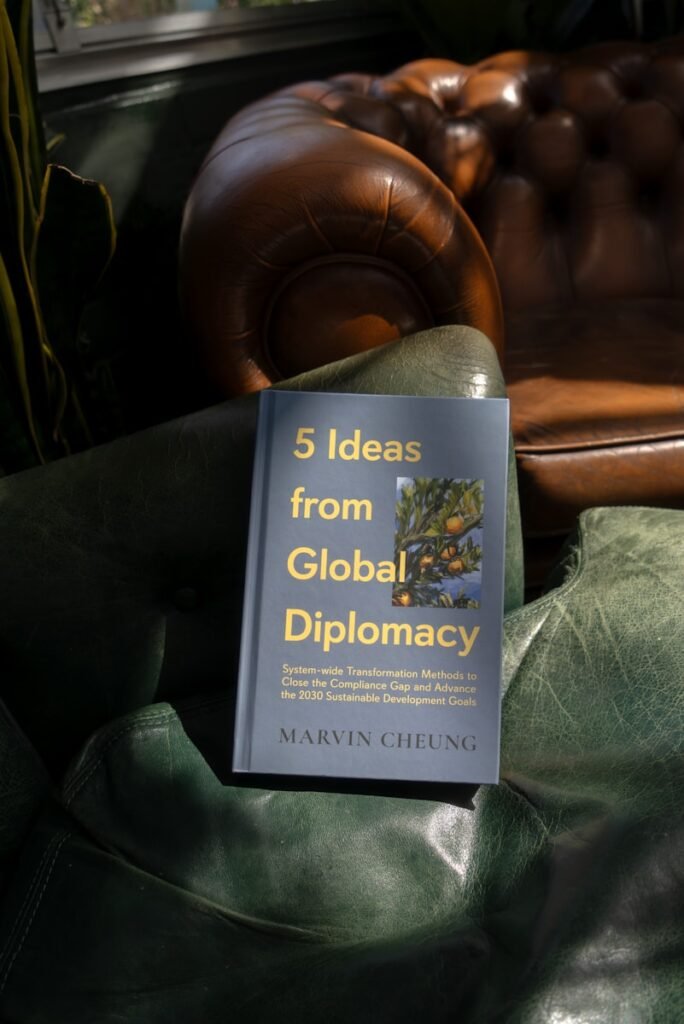A book sitting on top of a green chair