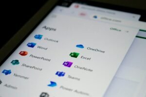 Unleashing AI Power in Outlook: What’s Next? 3 a close up of a cell phone screen with different app icons