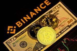 Zhao's Pardon: A New Era for Cryptocurrency? 3 gold round coin on brown and black box
