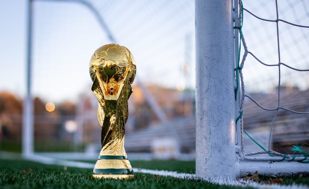 The Science of Success: How India’s "Compound" Strategy Secured the 2026 T20 World Cup Final Spot 6 a golden soccer trophy sitting on top of a soccer field