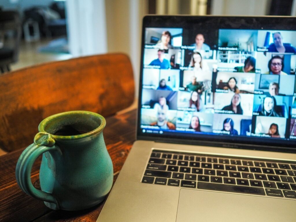 Zoom Introduces AI Avatars, Smart Office Apps, and Voice Translation in Major AI Expansion 2 macbook pro displaying group of people