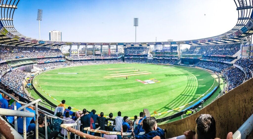 The $13.5 Million Showdown: Records and Rewards at the 2026 T20 World Cup Final 4 people sitting on bench on green grass field during daytime